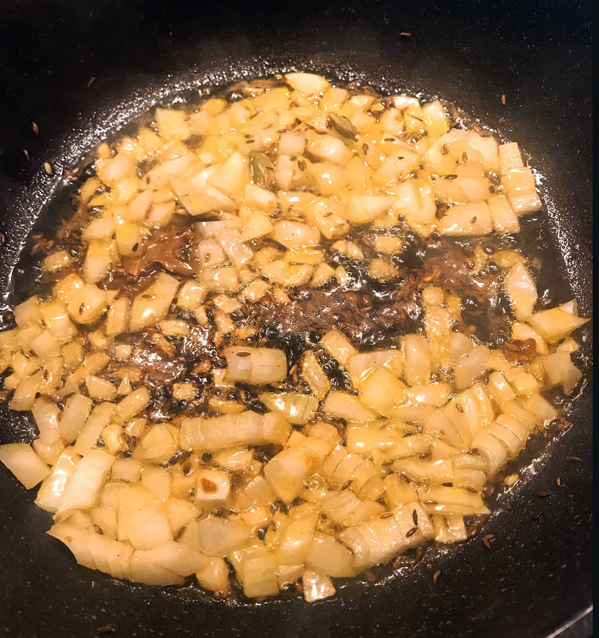 Frying onions in a pan 