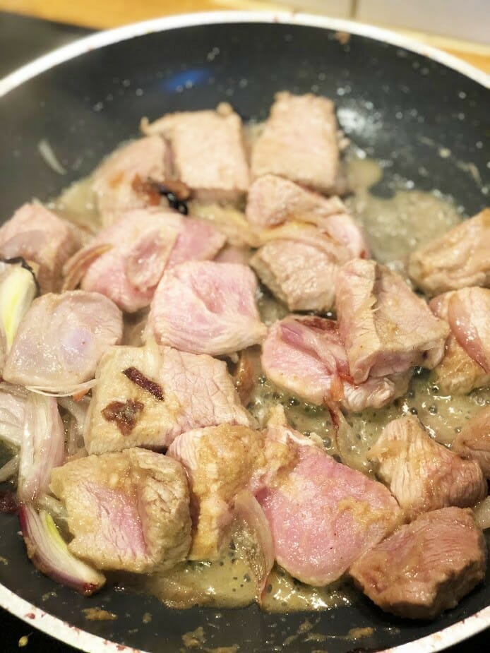 Add lamb to the onions