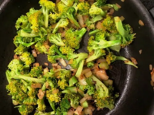 Saute broccoli for vegetarian wild rice casserole recipe
