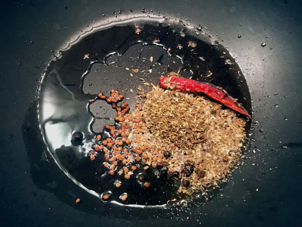 Fry whole spices in oil