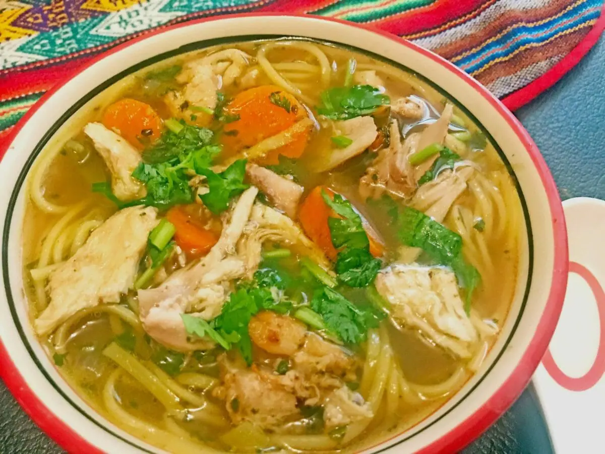 easy-homemade chicken noodle soup.  in a red bowl. thukpa recipe