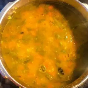 Add-water-to-daal for Indian daal recipe