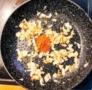 Vindaloo spice mix added to onions