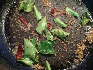 Tempering curry leaves in oil 
