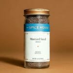 Yellow mustard seeds in a bottle  