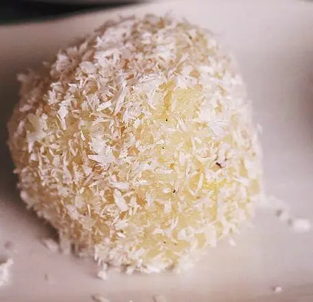 Coat coconut loddu wth dry desiccated coconut 