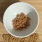 Crushed fenugreek seeds in a white bowl