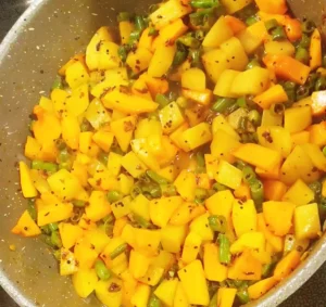 Indian Pumpkin, green beans and potatoes in a pan